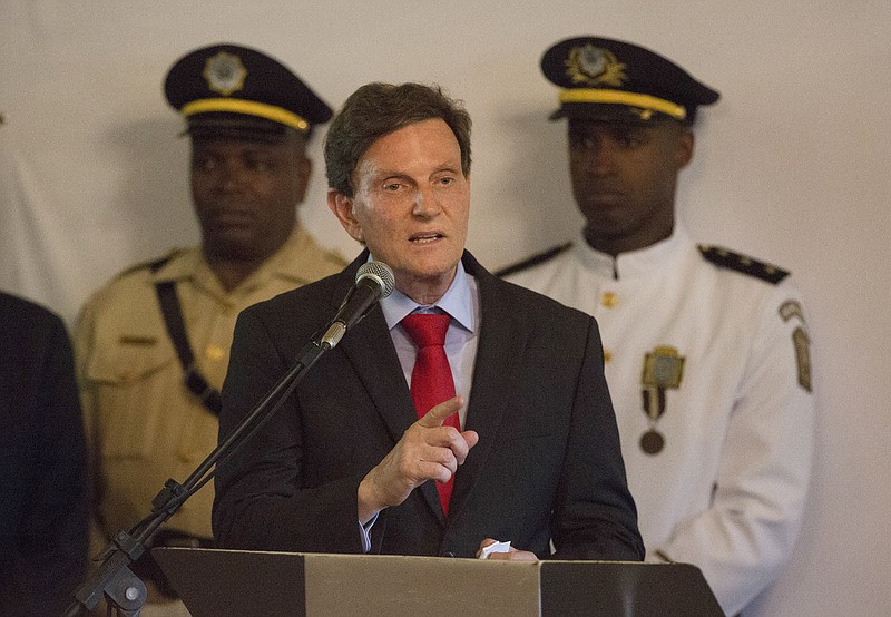 
              Marcelo Crivella, senator and bishop of the Universal Church of the Kingdom of God speaks during his inauguration ceremony as mayor of Rio de Janeiro, Brazil, Sunday, Jan. 1, 2017. (AP Photo/Leo Correa)
            