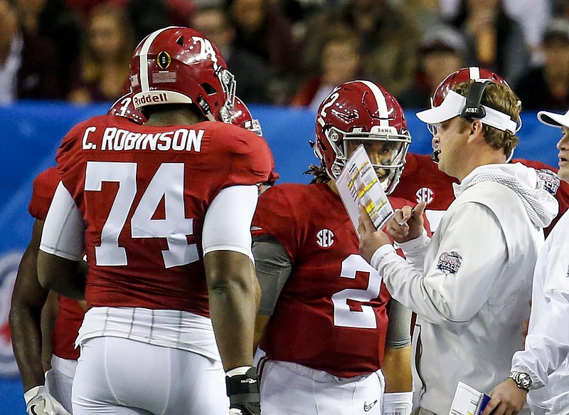 Lane Kiffin, now the former Alabama offensive coordinator, talks with Crimson Tide quarterback Jalen Hurts during the first half of Saturday's 24-7 win over Washington in the Peach Bowl.