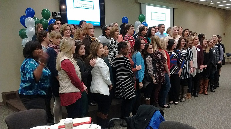 Some 60 Hamilton County teachers from 38 different schools who were given a total in $50,000 in Unum Strong Schools Grants grants on Tuesday pose for a group photo after a luncheon at Unum's headquarters in downtown Chattanooga.