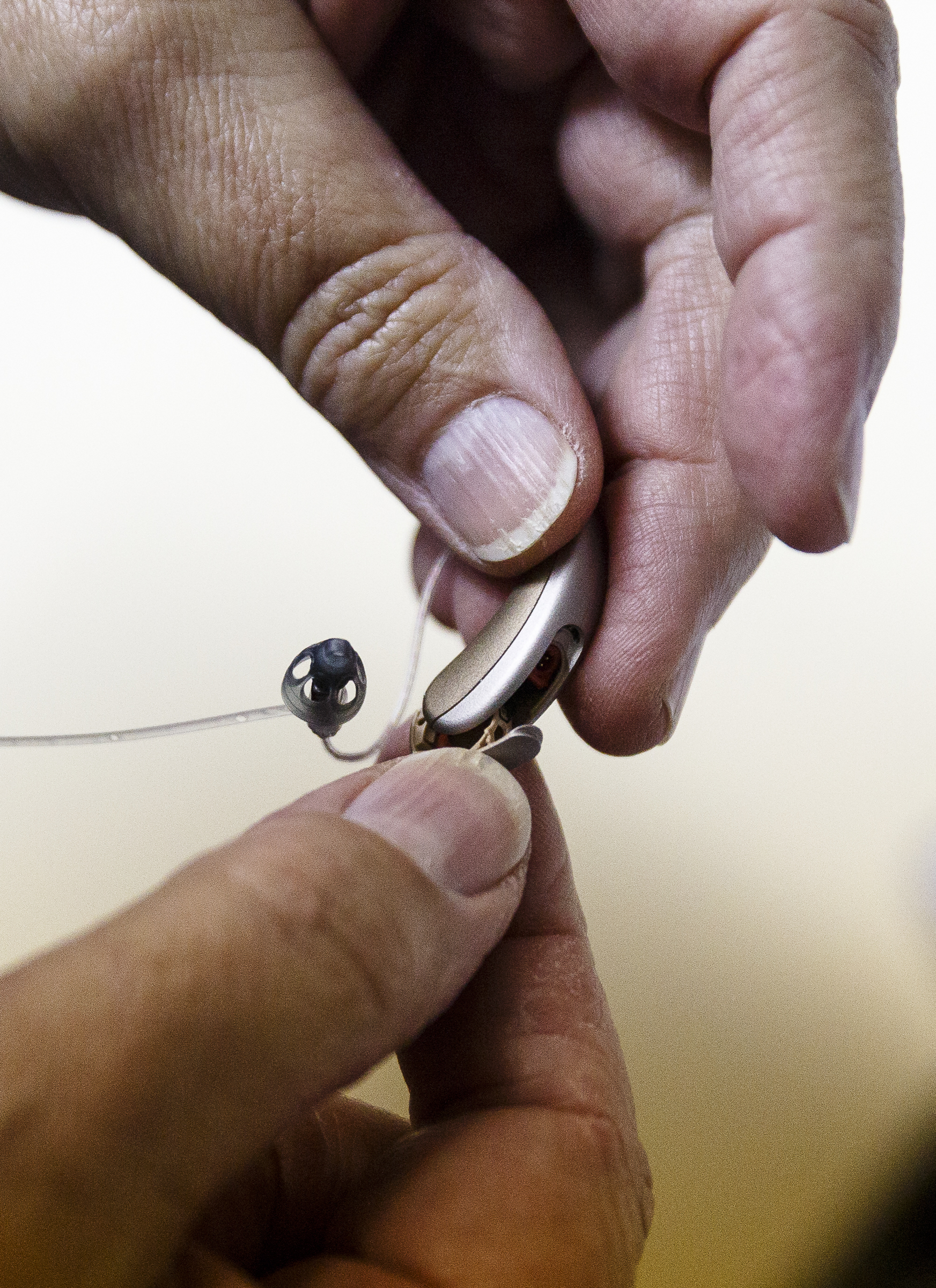 Audiologist Ursula Chaplin checks the functionality of a hearing aid at The Speech and Hearing Center on Thursday, Dec. 15, 2016, in Chattanooga, Tenn. The FDA will consider allowing the sale of over-the-counter hearing aids.