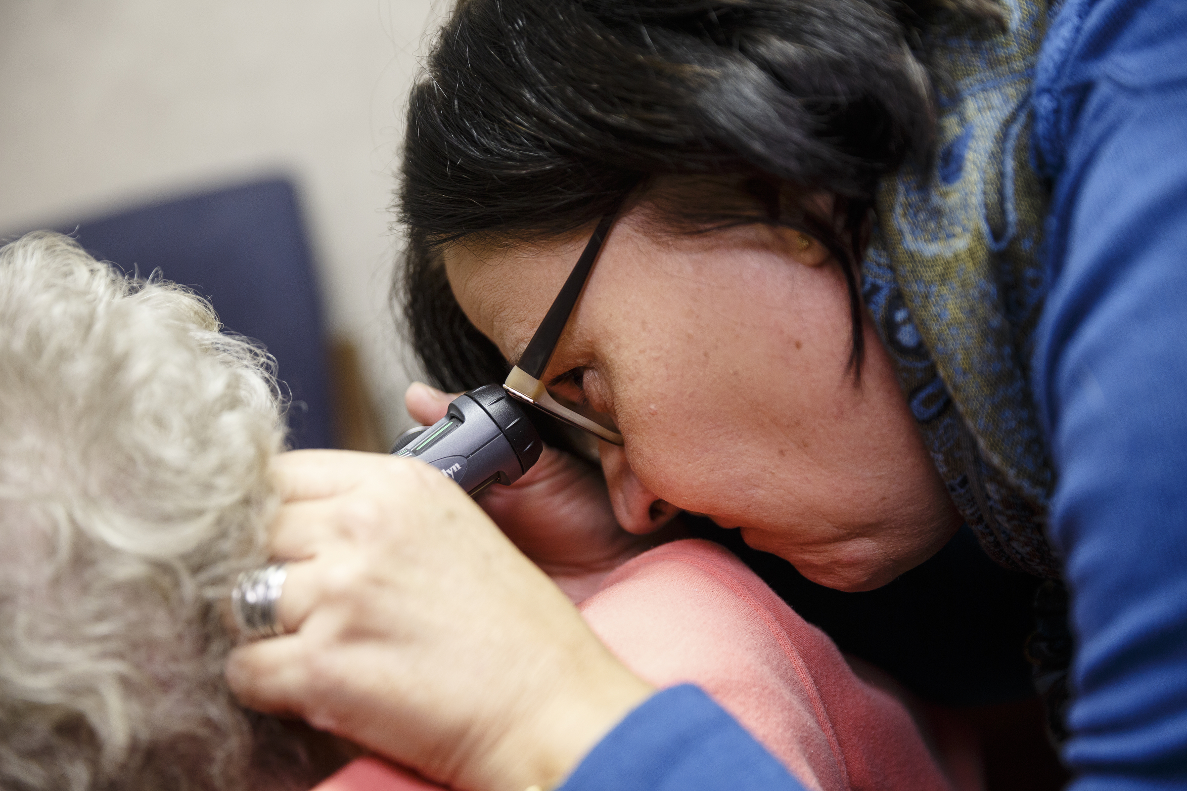 Audiologist Ursula Chaplin checks a patient's ear canal at The Speech and Hearing Center on Thursday, Dec. 15, 2016, in Chattanooga, Tenn. The FDA will consider allowing the sale of over-the-counter hearing aids.