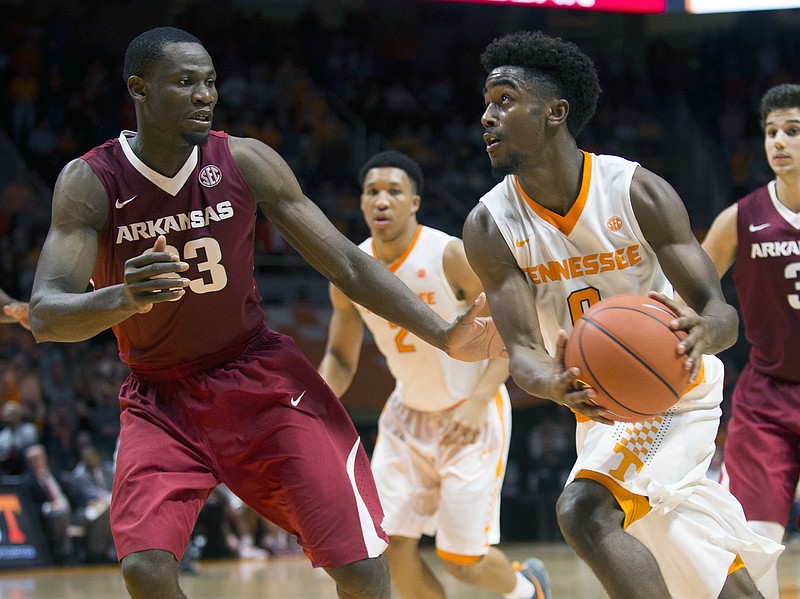 Tennessee's Jordan Bone (0) drives past Arkansas' Moses Kingsley (33) during the second half of an NCAA college basketball game, Tuesday, Jan. 3, 2017 in Knoxville, Tenn. (Brianna Paciorka/Knoxville News Sentinel via AP)