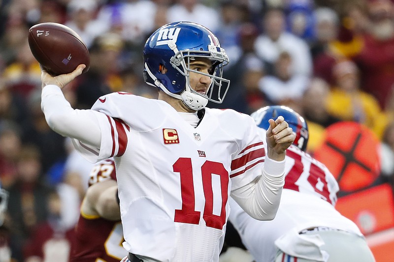 
              New York Giants quarterback Eli Manning (10) throws a pass during the first half of the team's NFL football game against the Washington Redskins in Landover, Md., Sunday, Jan. 1, 2017. (AP Photo/Alex Brandon)
            