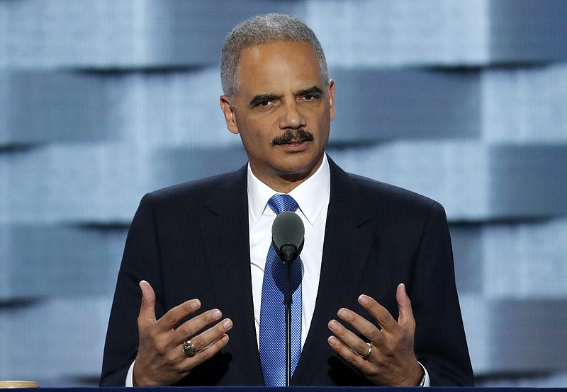 
              FILE - This July 26, 2016 file photo former Attorney General Eric Holder speaks during the second day of the Democratic National Convention in Philadelphia. Vowing to protect California's values and constitutional guarantees, the state Legislature has selected Holder to serve as outside counsel to advise the legal strategy against the incoming Trump administration. (AP Photo/J. Scott Applewhite,File)
            