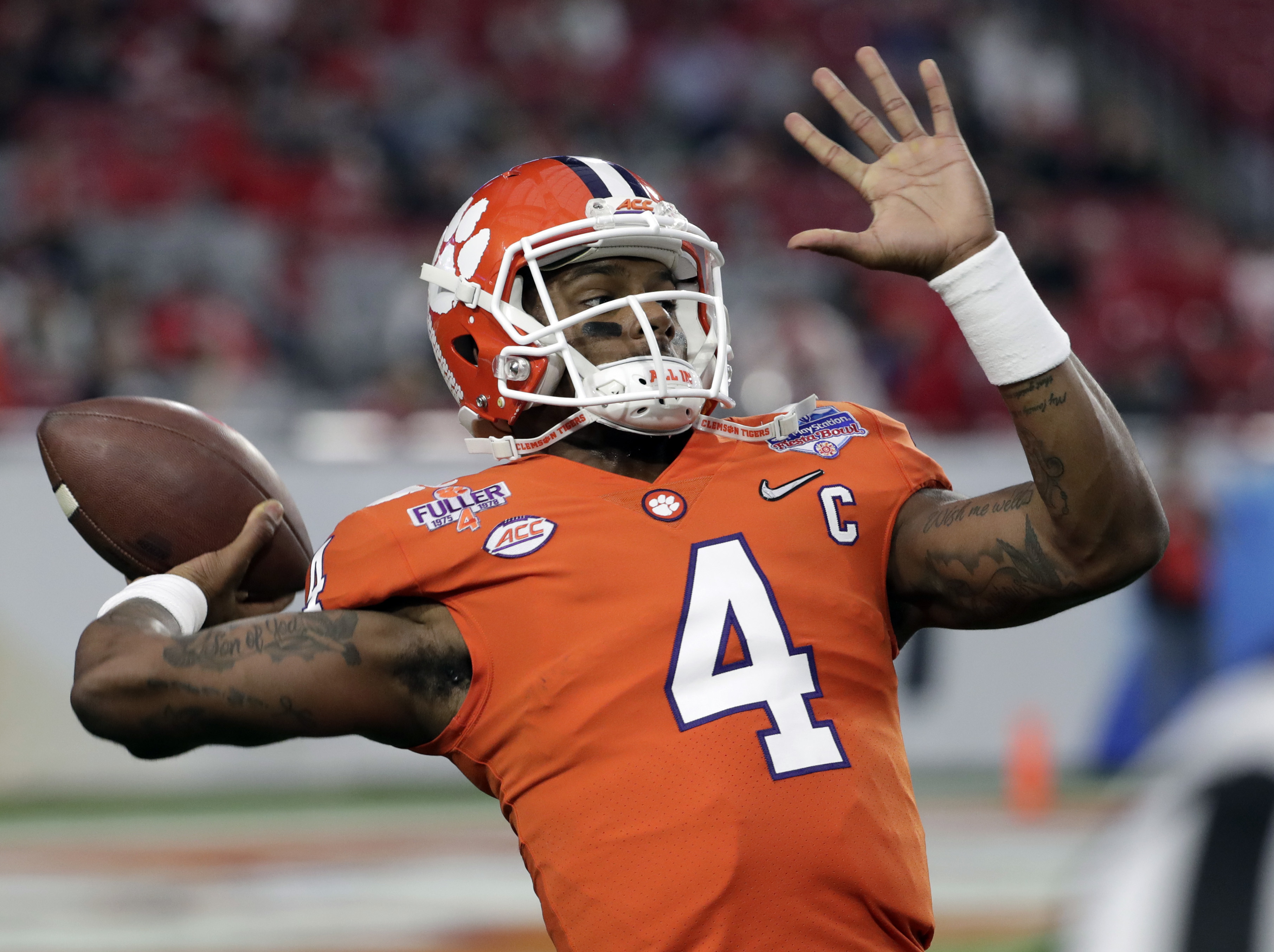 Clemson quarterback Deshaun Watson warms up prior to the team's Fiesta Bowl NCAA college football playoff semifinal against Ohio State, Saturday, Dec. 31, 2016, in Glendale, Ariz. (AP Photo/Rick Scuteri)
