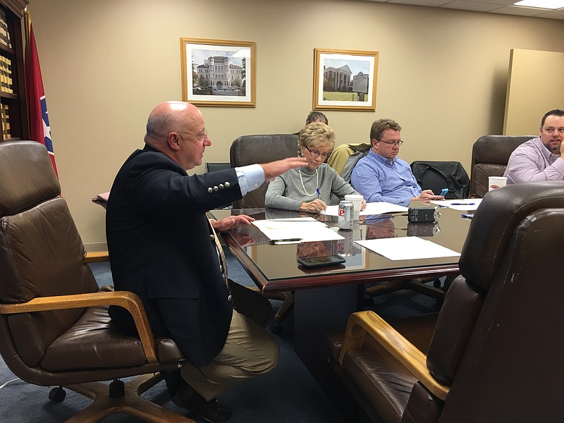 Hamilton County Election Commission Chairman Michael Walden, left, voices concern over additional early voting sites. Ruth Braly and Chris Clem, also commissioners, and Assistant Elections Administrator Scott Allen, listen.