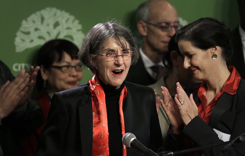 
              Oakland Mayor Libby Schaaf, right, applauds as newly named Oakland Chief of Police Anne Kirkpatrick, center, is introduced during a media conference Wednesday, Jan. 4, 2017, in Oakland, Calif. The troubled Oakland Police Department on Wednesday hired its first female leader, who is tasked with restoring confidence in an agency that cycled through three chiefs in as many weeks this summer after several officers were implicated in a sex scandal with an underage girl.  (AP Photo/Ben Margot)
            