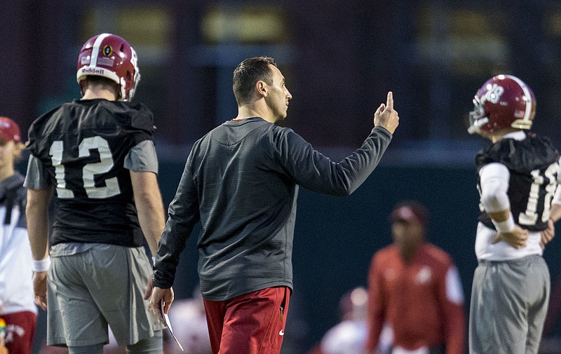 
              Alabama offensive coordinator Steve Sarkisian works with his players during football practice, Tuesday, Jan. 3, 2017, at the Thomas-Drew Practice Fields in Tuscaloosa, Ala. Seen in picture are Alabama quarterback David Cornwell (12) and Alabama quarterback Cooper Bateman (18). (Vasha Hunt/AL.com via AP)
            