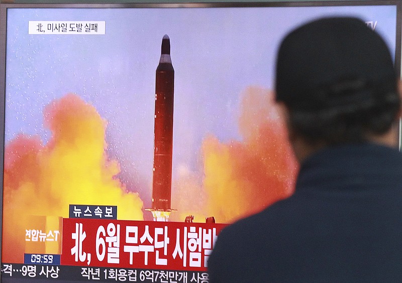 
              FILE - In this Oct. 16, 2016, file photo, a man watches a TV news program showing a file image of a missile launch conducted by North Korea, at the Seoul Railway Station in Seoul, South Korea. U.S. President-elect Donald Trump took to Twitter on Tuesday, Jan. 3, 2017, to vow that North Korea’s push to develop a nuclear weapon capable of reaching parts of the United States “won’t happen.” It may already have. The letters read "North attempted to fire a mid-range Musudan missile in June." (AP Photo/Ahn Young-joon, File)
            