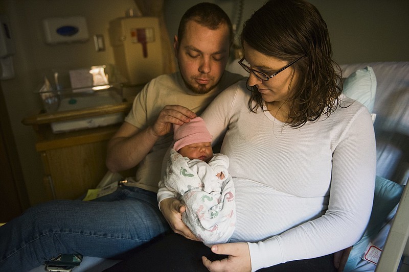 
              Two-day old daughter Heather Lynn Sherman is shown at Magee-Womens Hospital of UPMC in Pittsburg, Pa., Wednesday, Jan. 4, 2017. Her parents, Adam Sherman, 23, and Amanda Sherman, 23, of Harrisville, Pa., stopped in at South Hills Nissan on Monday for an oil change when Amanda visited the bathroom where she went into labor and delivered Heather three minutes later.  (Jack Fordyce/Pittsburgh Tribune-Review via AP)
            