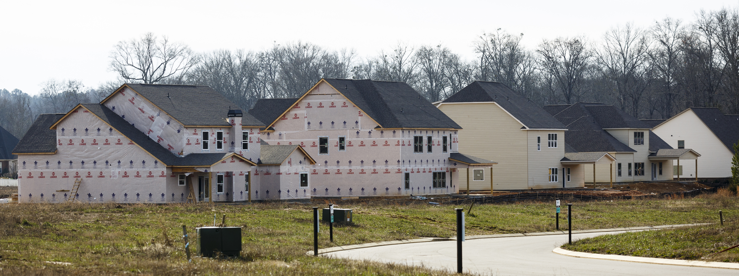Homes under construction are seen next to finished homes in the Meadowstream subdivision on Wednesday, Jan. 4, 2016, in Ooltewah, Tenn. Ooltewah and East Brainerd are two of the region's fastest developing residential areas.