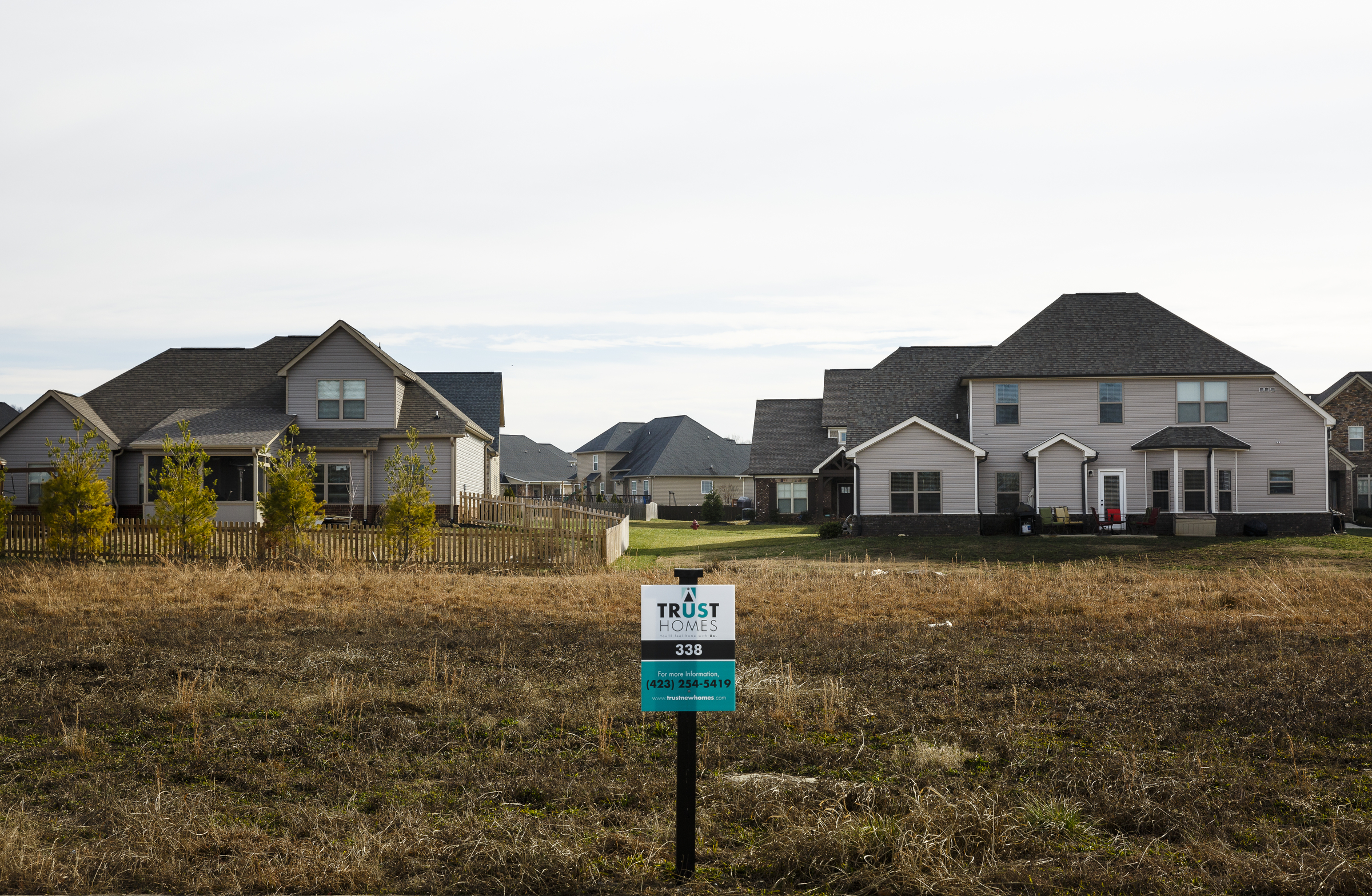 An available lot is seen ahead of constructed homes in the Meadowstream subdivision on Wednesday, Jan. 4, 2016, in Ooltewah, Tenn. Ooltewah and East Brainerd are two of the region's fastest developing residential areas.