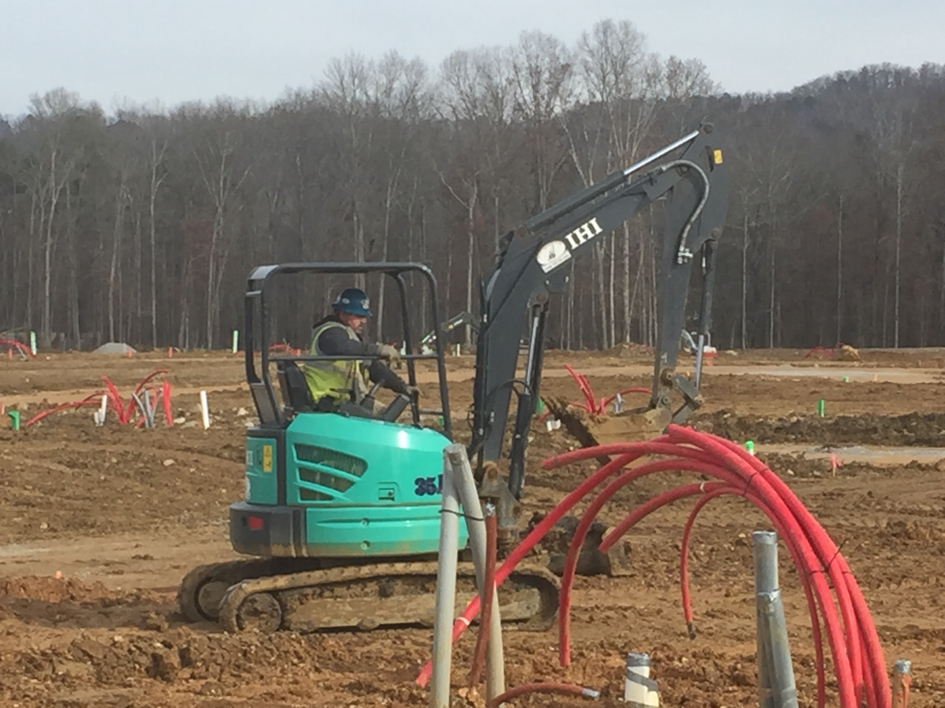 Earth-moving work underway at Cambridge Square in Ooltewah, where some 300 suburban homes are slated to be built near a 'town square' that recruited restaurants and other businesses popular with professionals who work downtown.