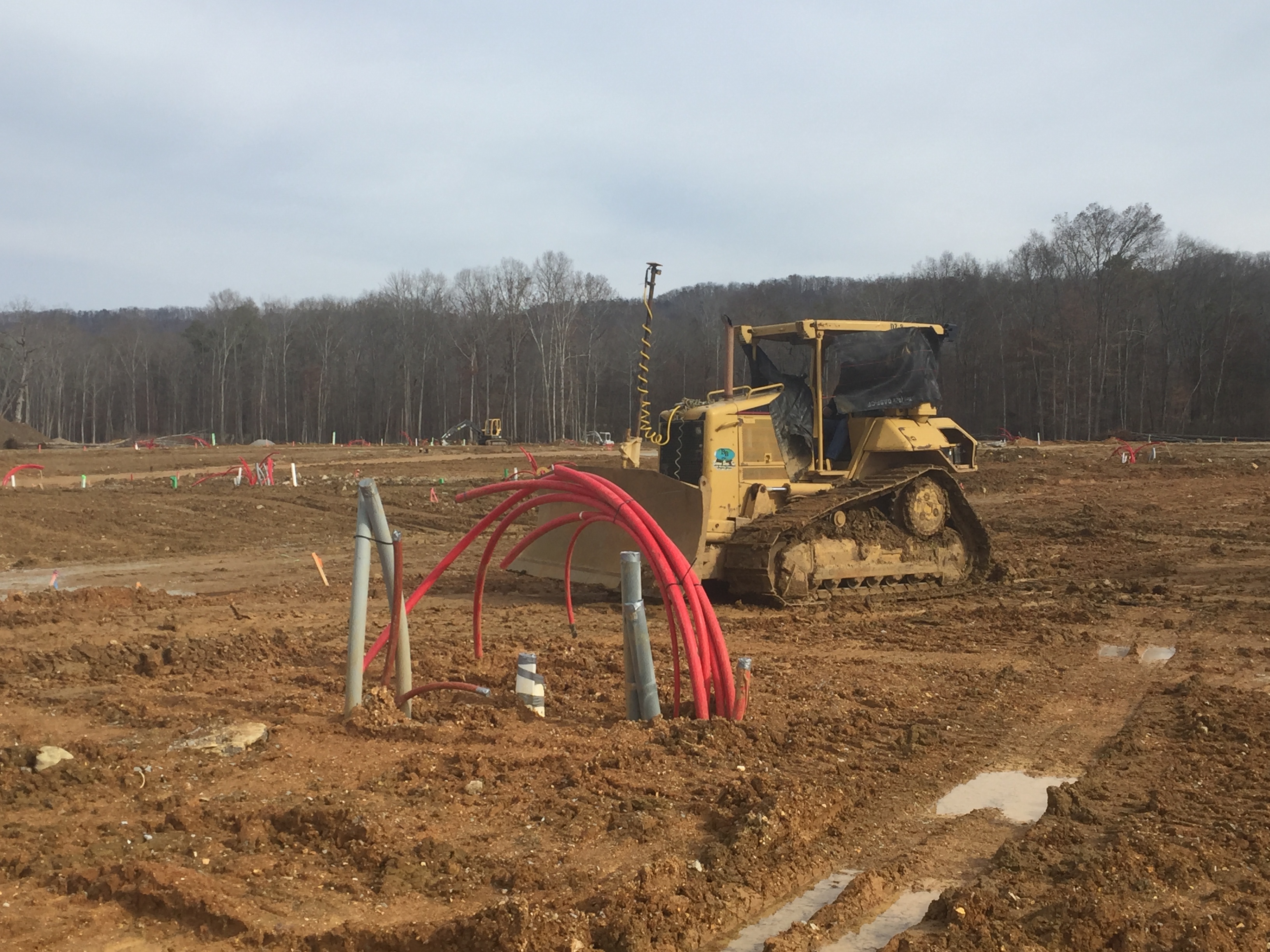 Earth-moving work underway at Cambridge Square in Ooltewah, where some 300 suburban homes are slated to be built near a 'town square' that recruited restaurants and other businesses popular with professionals who work downtown.