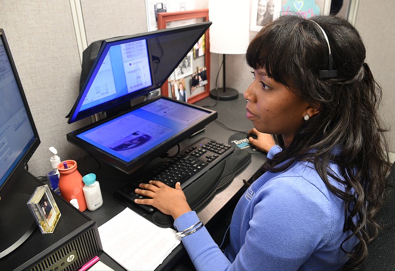 Live personal teller Kasi Phillips handles a customer transaction Wednesday, January 4, 2017 at Tennessee Valley Credit Union.