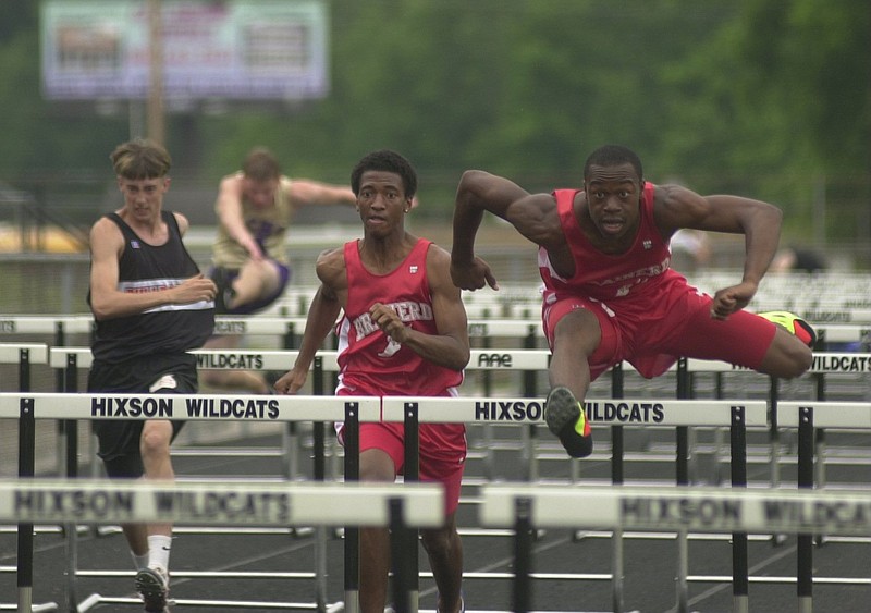 Hurdlers compete in a region track meet at Hixson High School.