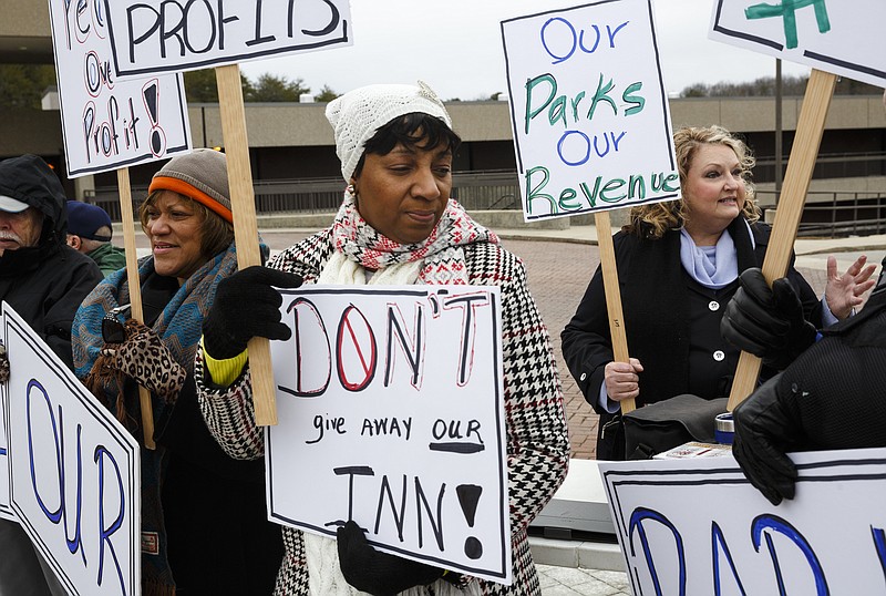 JoAnn Davis-Davis, left, Latanya McAdoo, center, and Pam Romans demonstrators protest the privatization of the Fall Creek Falls State Park's hospitality services with other demonstrators outside of the park's inn on Thursday, Jan. 5, 2017, near Spencer, Tenn. The Tennessee State Employees Association organized the protest, which coincided with a meeting by state officials and potential bidders at the park's inn.