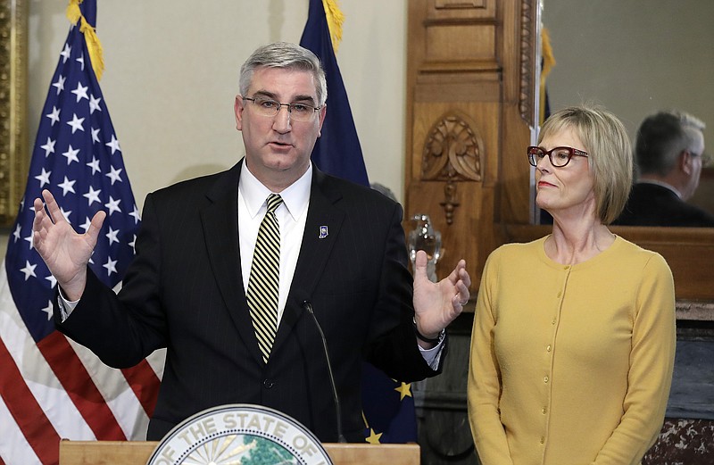 
              Indiana Governor-elect Eric Holcomb speaks as Lt. Governor-elect Suzanne Crouch listens during a news conference at the Statehouse Thursday, Jan. 5, 2017, in Indianapolis. Holcomb was discussing his priorities for the Indiana legislative session. (AP Photo/Darron Cummings)
            