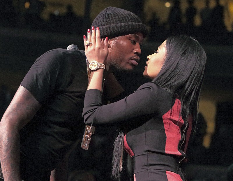 
              FILE - In this Oct. 23, 2015, file photo, Meek Mill and Nicki Minaj kiss after their performance at the Power 99 POWERHOUSE 2015 at the Wells Fargo Center in Philadelphia. Minaj announced on Twitter Jan. 5, 2017, that she is single. (Photo by Owen Sweeney/Invision/AP, File)
            