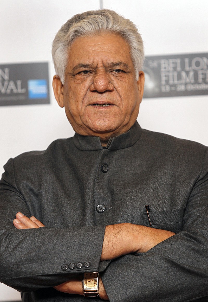 
              FILE - In this Oct. 19, 2010 file photo, Indian actor Om Puri poses during a London Film Festival photocall of West is West, at a central London cinema. Noted Indian character actor Puri died in the western city of Mumbai on Friday, Jan. 6, 2017. In a career spanning more than three decades, Puri had won a slew of national awards and international fame for his work in several critically acclaimed films. He also acted in the British comedy East is East, about the life of a Pakistani immigrant in England and had a small role in Richard Attenborough’s film “Gandhi,” based on the life of the Indian freedom leader Mohandas Gandhi. (AP Photo/Joel Ryan, File)
            