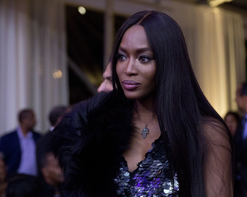 
              FILE - In this Oct. 21, 2016, file photo, model Naomi Campbell, center, arrives at a BET event hosted by President Barack Obama and first lady Michelle Obama on the South Lawn of the White House, in Washington. Campbell revealed that she was the victim of a 2012 attempted robbery in Paris during an appearance on "The Wendy Williams Show" Thursday, Jan. 5, 2016. (AP Photo/Carolyn Kaster, File)
            