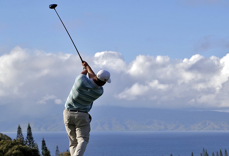 
              Ryan Moore hits from the 18th tee during the first round of the Tournament of Champions golf event, Thursday, Jan. 5, 2017, at Kapalua Plantation Course in Kapalua, Hawaii. (AP Photo/Matt York)
            