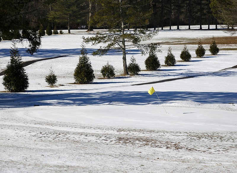 Snow covers the fairway of the Concord Golf Club after an overnight winter storm brought snow to the region Saturday, Jan. 7, 2017, in Chattanooga, Tenn. Icy roads caused headaches for motorists as the temperatures dropped into the teens overnight.