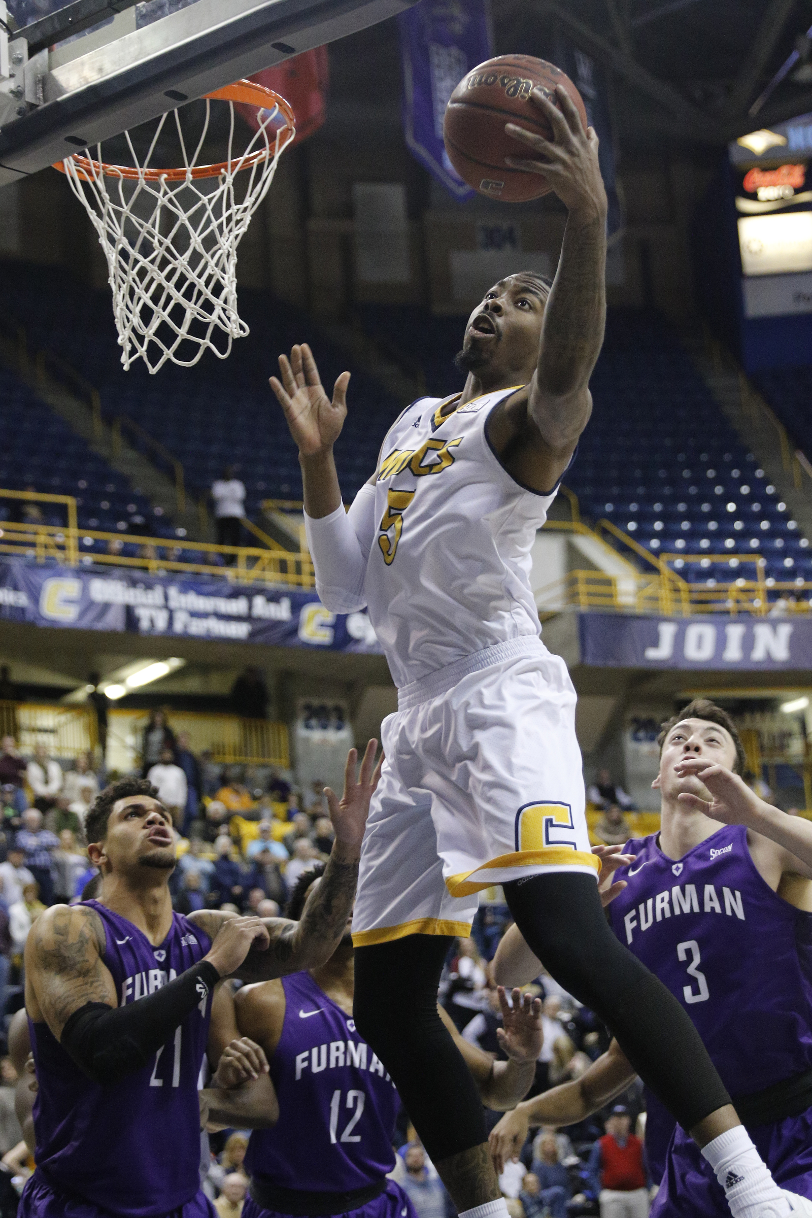 UTC forward Justin Tuoyo rebounds the ball during the Mocs' home basketball game against Furman at McKenzie Arena on Saturday, Jan. 7, 2017, in Chattanooga, Tenn.