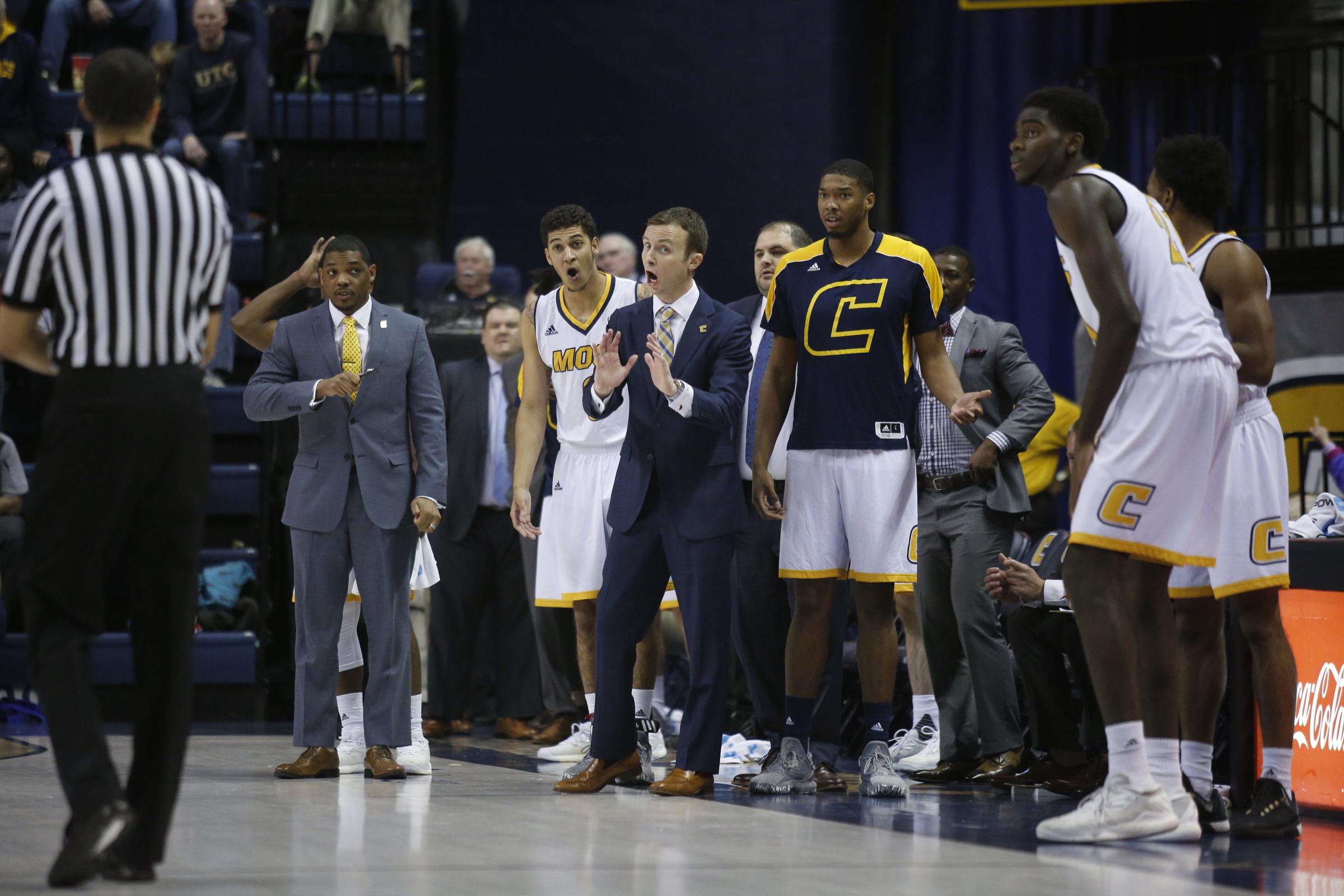 UTC basketball coach Matt McCall, center, and the bench object to an official's call during the Mocs' home basketball game against Furman at McKenzie Arena on Saturday, Jan. 7, 2017, in Chattanooga, Tenn.