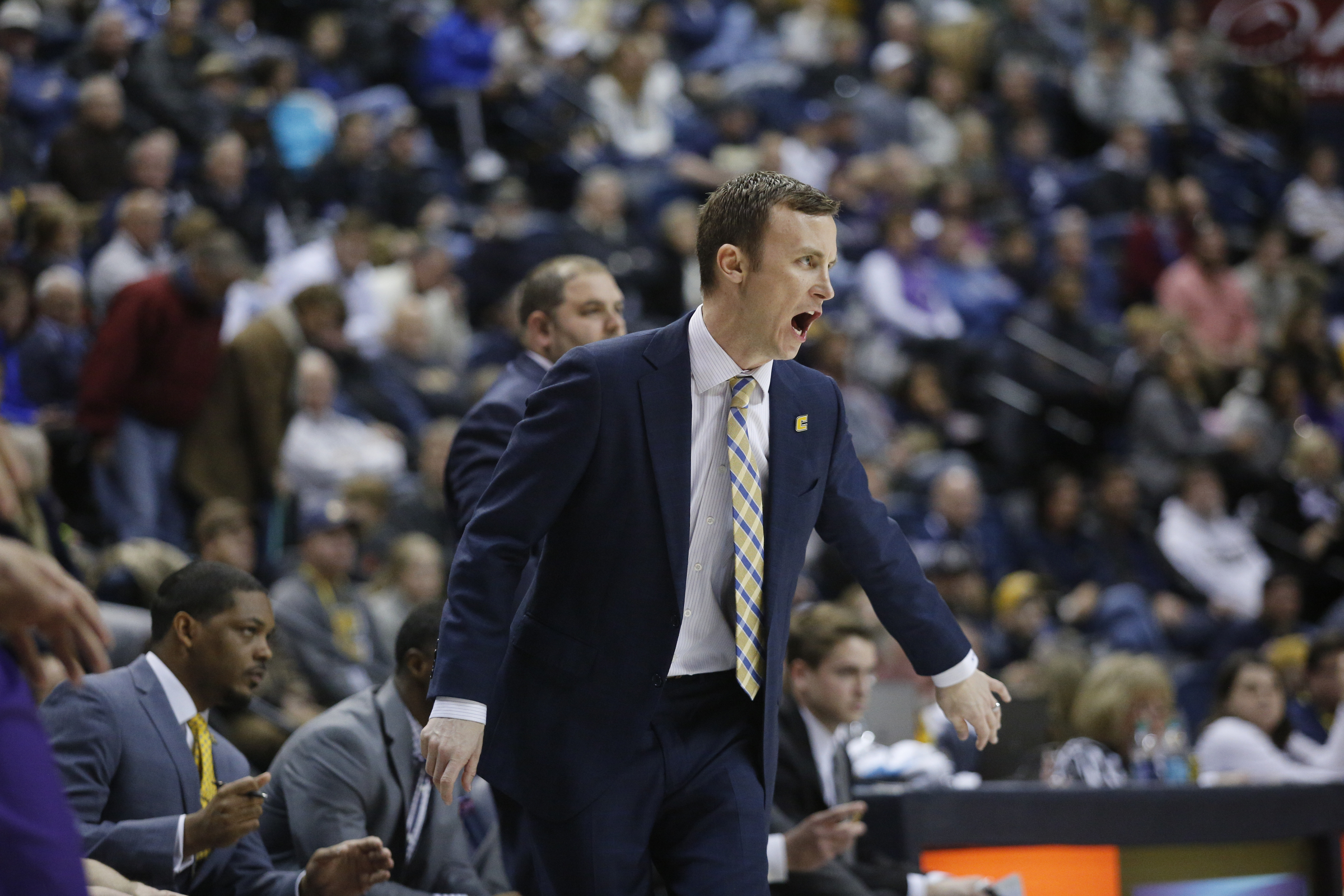 UTC men's basketball coach Matt McCall directs players during the Mocs' home basketball game against Furman at McKenzie Arena on Saturday, Jan. 7, 2017, in Chattanooga, Tenn.