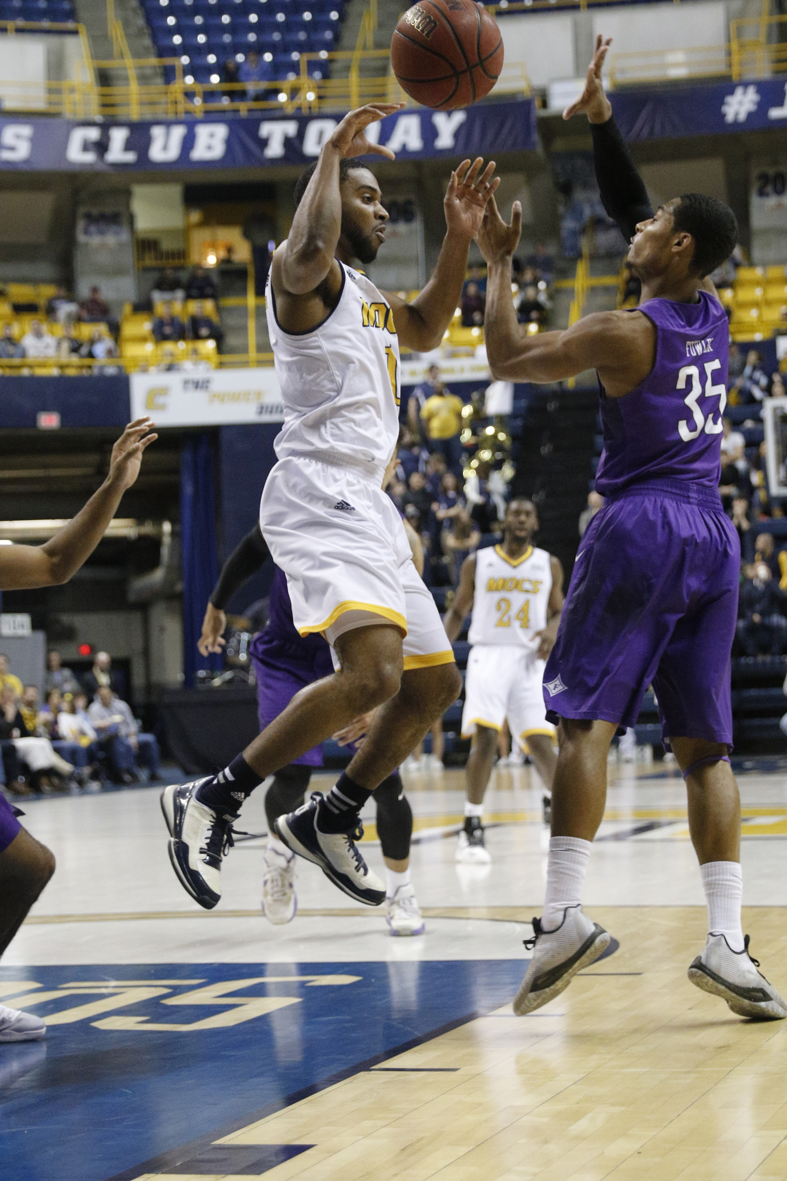 UTC guard Greg Pryor tries to pass around Furman guard Daniel Fowler (35) during the Mocs' home basketball game against Furman at McKenzie Arena on Saturday, Jan. 7, 2017, in Chattanooga, Tenn.