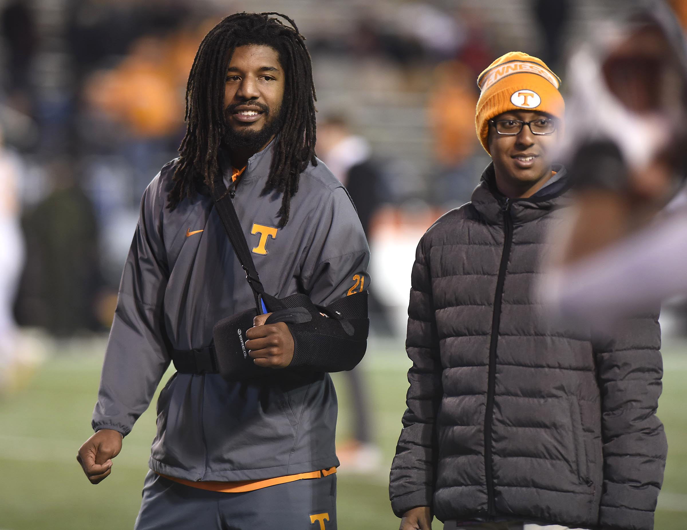 An injured Jalen Reeves-Maybin (21) watches his teammates warm up. The Tennessee Volunteers visited the Vanderbilt Commodores in a cross-state rivalry at Dudley Stadium on November 26, 2016.