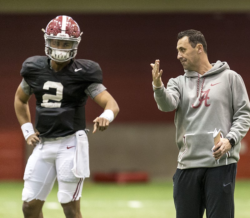 New Alabama offensive coordinator Steve Sarkisian, right, works with quarterback Jalen Hurts during this past Thursday's practice in Tuscaloosa.