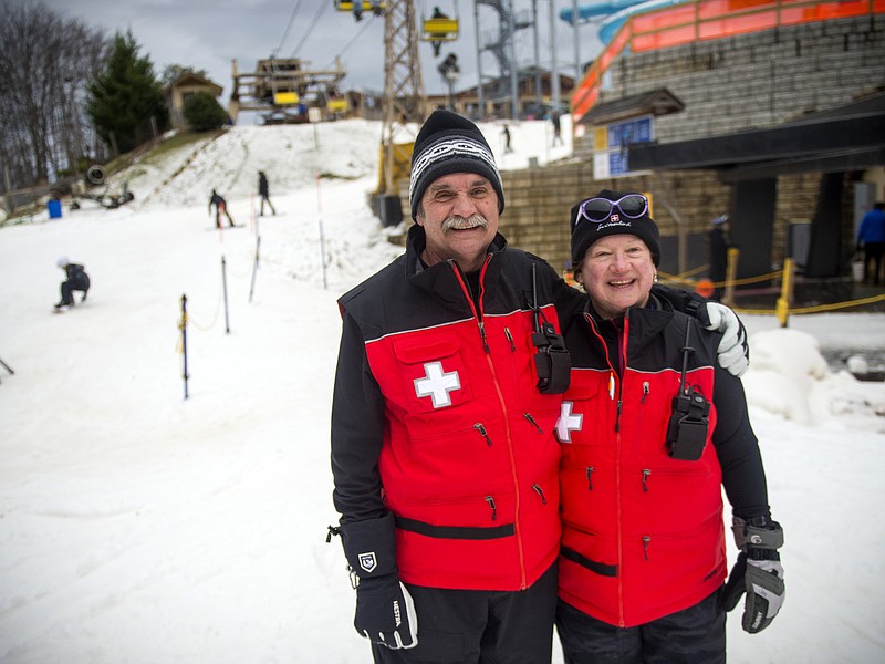 
              In this Saturday, Dec. 31, 2016 photo, Ski Patrol members Peter and Joy Juker pause on the slopes at the Ober Gatlinburg resort in Gatlinburg, Tenn. The Gatlinburg wildfire took the house they owned, along with the homes of two other ski patrol members. (Brianna Paciorka/Knoxville News Sentinel via AP)
            