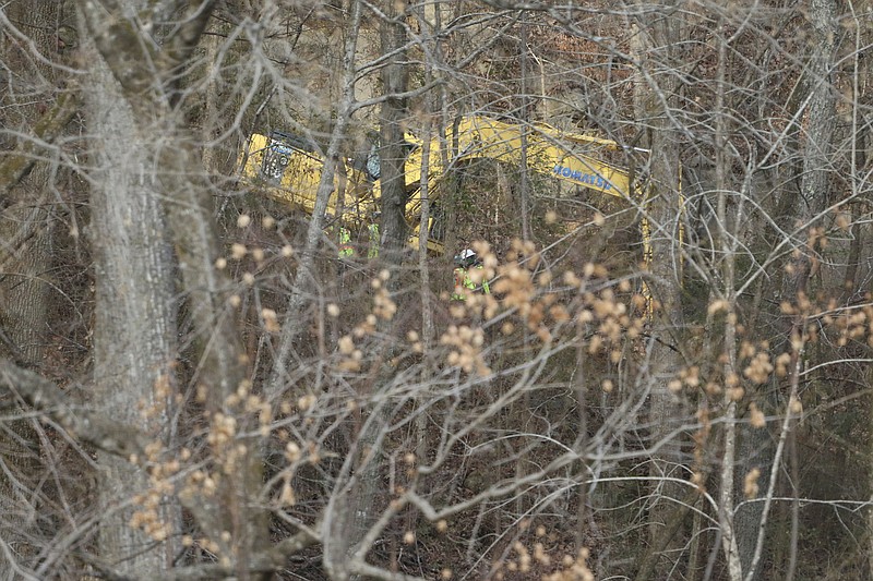 Staff Photo by Dan Henry / The Chattanooga Times Free Press- 1/8/17. Colonial pipeline group personnel and emergency workers search for a liquid gas leak along Shoal Creek near the suck Creek boat ramp on Sunday, January 8, 2017.