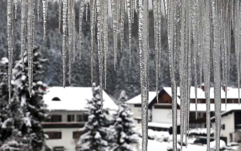 
              Icicles hang from a roof of a house in Oberstdorf, southern Germany, Sunday Jan. 8, 2017.  Heavy snowfall and below-freezing temperatures continued to sweep the European continent, causing more than a dozen deaths, grounding airplanes and crippling ferries in Italy and Turkey.  (Karl-Josef Hildenbrand/dpa via AP)
            