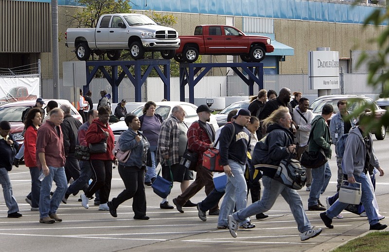 
              FILE - In an Oct. 24, 2007 file photo, workers leave the Warren Truck Assembly, a Chrysler automobile factory, during a shift change in Warren, Mich. Fiat Chrysler said Sunday, Jan. 8. 2017, it will add three new Jeeps to its lineup including a pickup truck as it invests $1 billion in two U.S. factories and creates 2,000 new jobs. (AP Photo/Carlos Osorio, File)
            