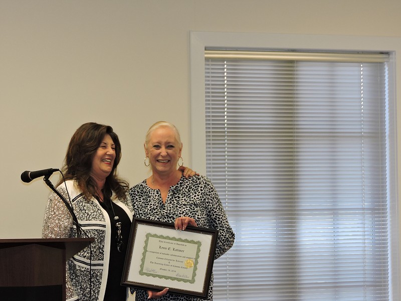 Catoosa Citizens for Literacy Director Shirley Smith, left, congratulates Lynn Latimer for her valuable collaboration and support in helping the Catoosa Citizens for Literacy Center.