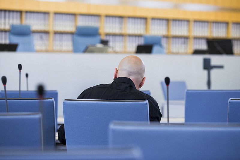 
              FILE - In this June 22, 2016 file picture accused Frank S. sits in a courtroom of the higher regional court in Duesseldorf, Germany.  A German federal court has rejected an appeal Monday Jan. 9, 2017 by a far-right extremist sentenced to 14 years in prison for the attempted murder of a politician who is now Cologne’s mayor. The defendant, identified only as Frank S. in line with German privacy rules, was convicted by a Duesseldorf court in July. Henriette Reker, who was in charge  of housing refugees in Cologne at the time, was stabbed in the neck Oct. 17, 2015 as she campaigned.  (Rolf Vennenbernd/dpa via AP, file)
            