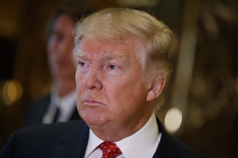 
              President-elect Donald Trump listens to a reporters question at Trump Tower in New York, Monday, Jan. 9, 2017. (AP Photo/Evan Vucci)
            