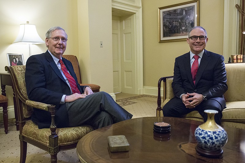 
              Senate Majority Leader Mitch McConnell, R-Ky., left, meets with Environmental Protection Agency (EPA) Administrator-designate Scott Pruitt, right, on Capitol Hill in Washington, Thursday, Jan. 6, 2017. (AP Photo/Zach Gibson)
            