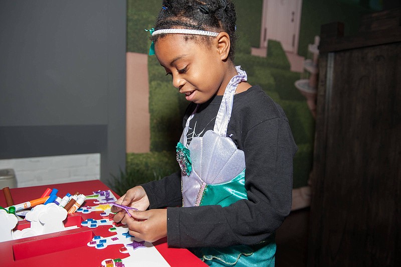 Children visiting the "Kings, Queens & Castles" exhibit can design their own crown and put on a royal cape to play king or queen.