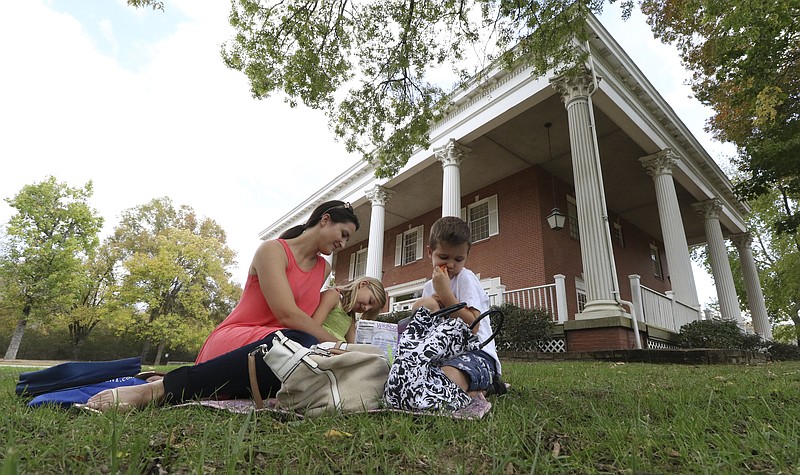 Brenda Mayer enjoys the fall weather and has a picnic with her children Carli, 6, and Mason, 4, while at Heritage Park on Tuesday, October 18, 2016.