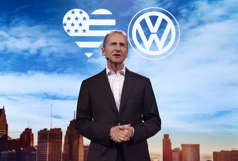 Herbert Diess, Member of the Board of Management of Volkswagen AG, Chairman of the Board of Management of the Volkswagen Passenger Cars brand speaks before the North American International Auto Show in Detroit, Sunday, Jan. 8, 2017. (AP Photo/Paul Sancya)