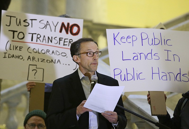 
              FILE  - This March 2, 2015, file photo, Black Diamond Equipment founder Peter Metcalf speaks during a rally to demonstrate opposition to efforts by some Western states to seize control of federal lands, at the Utah State Capitol, in Salt Lake City. Metcalf, a powerful outdoor recreation industry executive says the world's largest outdoor retail show should leave Utah after two decades because of what he calls an assault on public lands by the state's top political leaders. Metcalf's comments Tuesday, Jan. 10, 2017, come on the opening day of the Outdoor Retailer show. (AP Photo/Rick Bowmer, File)
            