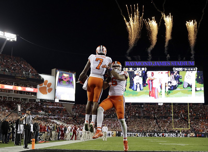 Clemson's Mike Williams (7) celebrates his touchdown catch with teammate Jordan Leggett during the second half of the NCAA college football playoff championship game against Alabama Monday, Jan. 9, 2017, in Tampa, Fla. (AP Photo/David J. Phillip)