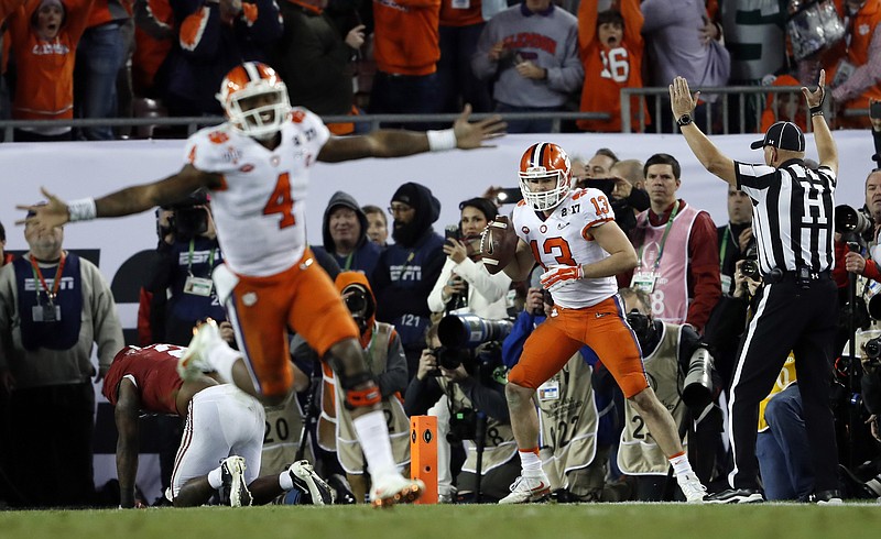 Clemson's Deshaun Watson celebrates a last second touchdown pass to Hunter Renfrow (13) during the second half of the NCAA college football playoff championship game against Alabama Tuesday, Jan. 10, 2017, in Tampa, Fla. (AP Photo/John Bazemore)