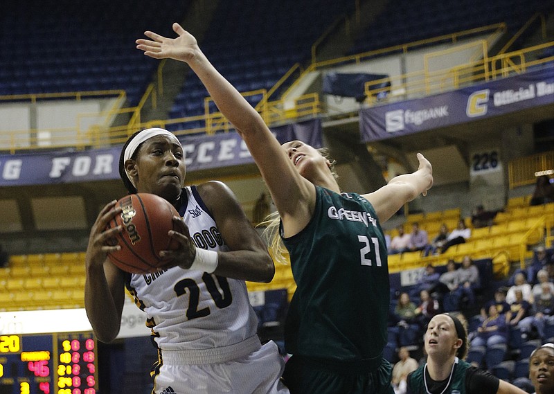 UTC guard Keiana Gilbert, left, rebounds ahead of Wisconsin Green-Bay guard Jessica Lindstrom during the Lady Mocs' home basketball game against the Wisconsin-Green Bay Phoenix at McKenzie Arena on Friday, Nov. 25, 2016, in Chattanooga, Tenn.