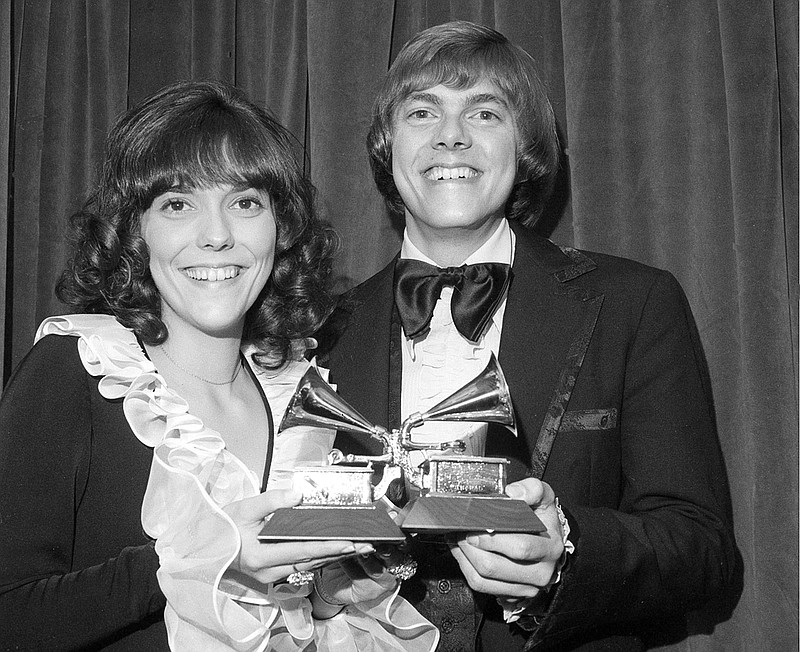 
              FILE - This March 14, 1972 file photo shows Karen Carpenter, left, and Richard Carpenter, of The Carpenters, posing with their award for best pop vocal per during the 14th annual 1971 Grammy Awards in New York. Richard Carpenter sued Universal Music Group on Wednesday, Jan. 11, 2017, seeking more than $2 million in royalties he says are owed to him and the estate of his late sister for sales of digital music on services such as Apple's iTunes. The Carpenters won three Grammy Awards, including for 
their song "Close to You." (AP Photo/File)
            