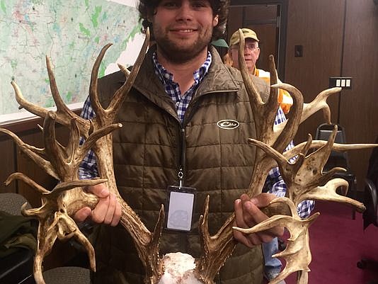 Stephen Tucker of Gallatin holds up the 47-point antlers from the deer he killed in November, which was declared a world record by a panel of Boone and Crockett judges Monday.
(Photo: Submitted/Tennessean)